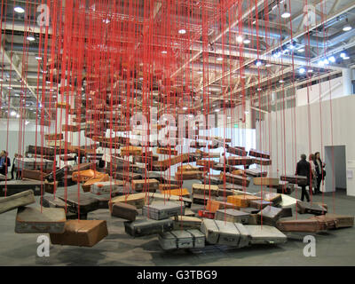Basel, Switzerland. 14th June, 2016. A giant installation of flying suitcases by Chiharu Shiota is one of the eyecatchers at the art fair Art Basel in Basel, Switzerland, 14 June 2016. The fair is known as one of the most prominent fairs for art from the 20th and 21st century. Photo: Sabine Glaubitz/dpa/Alamy Live News Stock Photo