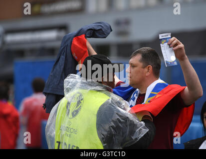 Lille Metropole, France. 15th June, 2016. A supporter of Team Slovakia is checked before the UEFA Euro 2016 Group B soccer match Russia and Slovakia at Stade Pierre Mauroy in Lille Metropole, France, 15 June 2016. Photo: Marius Becker/dpa/Alamy Live News Stock Photo