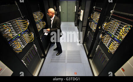 The director of the IT service center, Frank Wossal, stands in front of the new high performance computer 'Janus' at Martin Luther University in Halle/Saale, Germany, 15 June 2016. The 2.25-million-euro computer has over 48 terabytes of storage and can access up to 6,560 core processors. Scientists in various fields will be able to use it to conduct extremely complicated and data-intensive calculations. Photo: JAN WOITAS/dpa Stock Photo