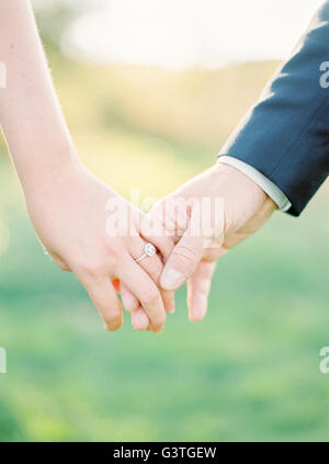 Sweden, Close-up of holding hands of newlyweds Stock Photo