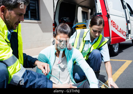 Ambulance men taking care of injured people Stock Photo - Alamy