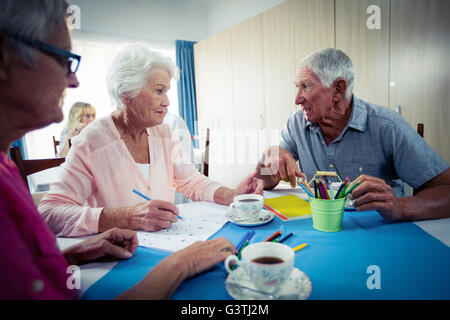 Group of seniors drawing and interacting Stock Photo