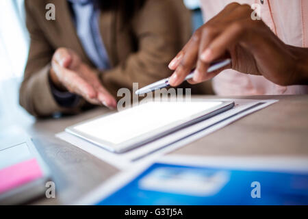Two businesswoman using a tablet computer Stock Photo