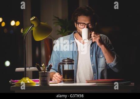 Hipster drinking coffee Stock Photo