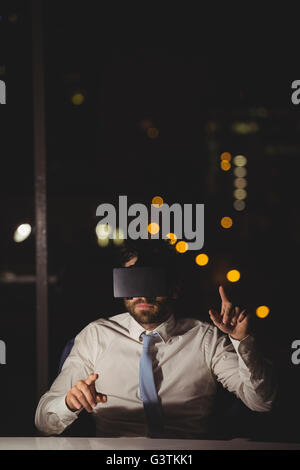 Businessman using virtual reality device Stock Photo