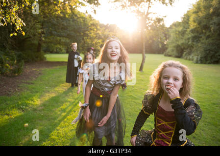 Two children dressed in costume for Halloween Night. Stock Photo