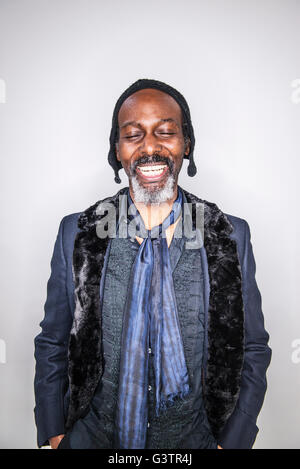 A mature african man posing in a studio smiling. Stock Photo