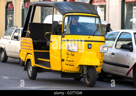 Vehicles  (Tuk-Tuk) on side street. Lisbon. portugal Stock Photo