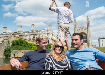 Friends enjoying a lazy afternoon punting on the River Cam in Cambridge. Stock Photo