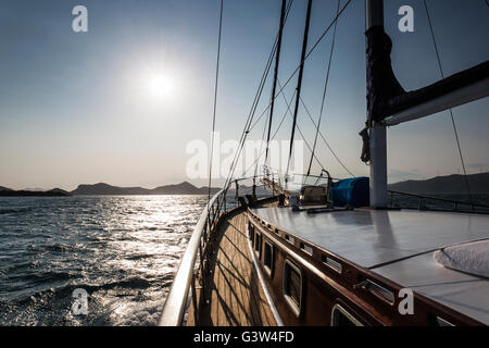 Sailing towers the sun on a sail boat on the Adriatic sea in Croatia Stock Photo