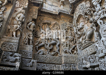 Wall panel relief. Hindu deities, Garuda fighting with the snakes in the center, West side, Hoysaleswara temple Karnataka India Stock Photo