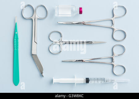 Studio shot of surgical scissors, scalpel and syringe Stock Photo