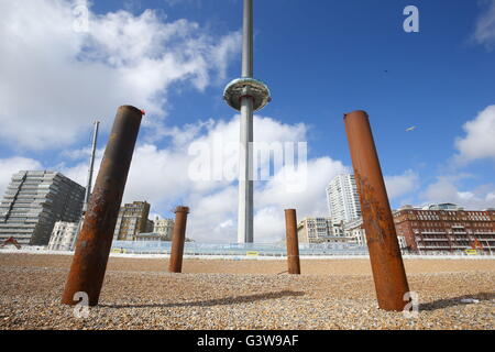The British Airways i360 observation pod in Brighton, seen through the remains of the West Pier, as this week has reached its maximum height of 138 metres. Stock Photo