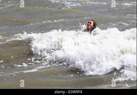 Kitty Hall enjoys the sea in Brighton, East Sussex, during the afternoon sunshine. Stock Photo