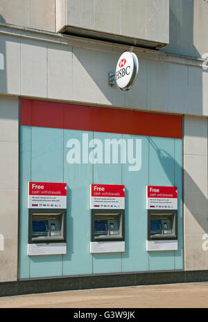 HSBC bank 3 three ATM ATMs outside exterior cash machine machines branch England UK United Kingdom GB Great Britain Stock Photo