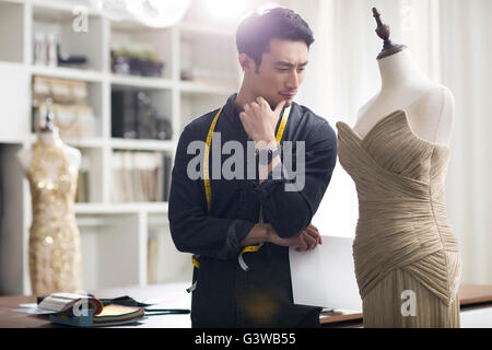 Fashion designer working in studio Stock Photo