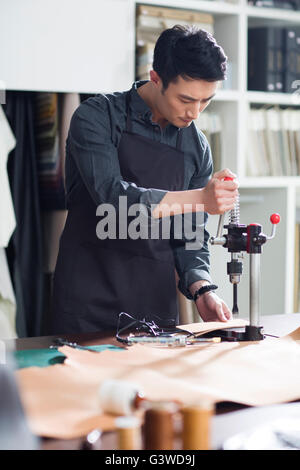 Craftsman working in his studio Stock Photo