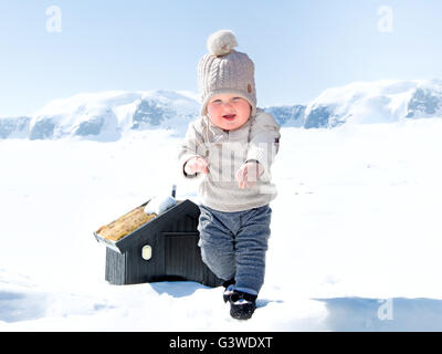 Baby boy in the snow Stock Photo