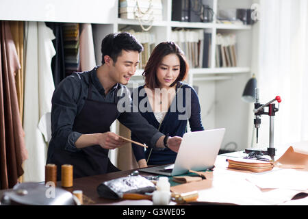 Craftsman and customer talking in studio Stock Photo