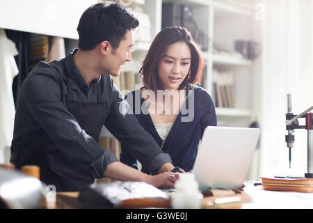 Craftsman and customer talking in studio Stock Photo