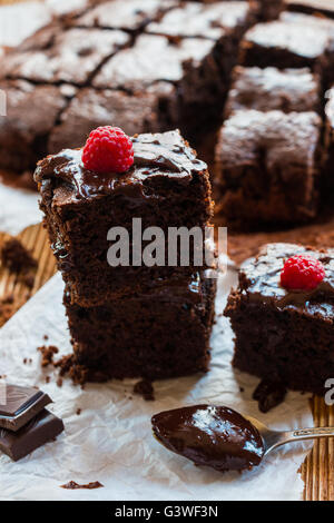 Homemade chocolate brownies with raspberry on the wooden background Stock Photo