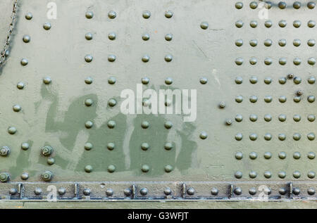 Abstract dark green industrial metal background texture with rivets Stock Photo