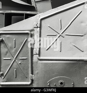 Abstract gray industrial metal background texture with manholes, details of Russian armored train from WWII time Stock Photo