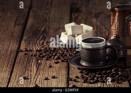 Coffee cup and turkish delights on wooden background Stock Photo