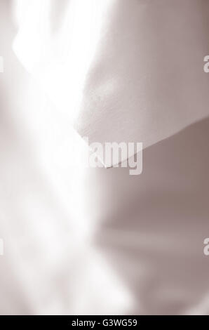 Close up detail of edge of white crisp pillow Case Stock Photo