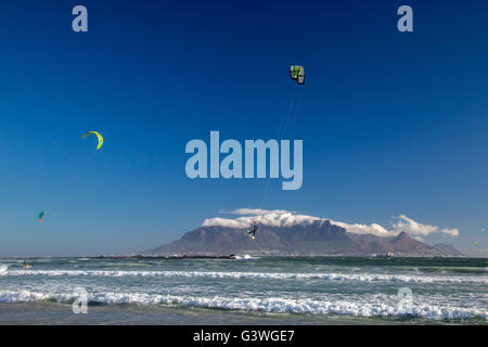 Kite surfer doing an aerial stunt against the backdrop of Table Mountain in Cape Town Stock Photo