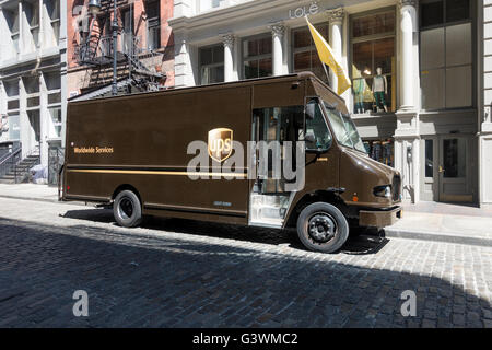 A UPS delivery truck parked on a cobblestone street the SoHo in New York City Stock Photo