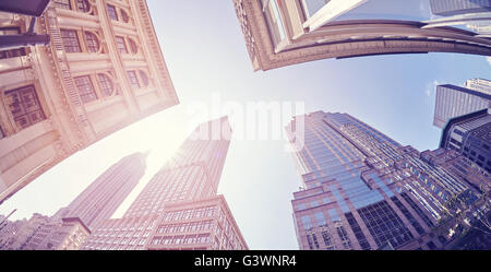 Vintage stylized fisheye lens photo of skyscrapers in Manhattan at sunset, New York City, USA. Stock Photo