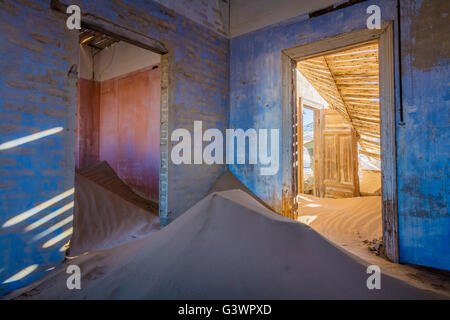 Kolmanskop (Afrikaans for Coleman's hill, German: Kolmannskuppe) is a ghost town in the Namib desert in southern Namibia. Stock Photo