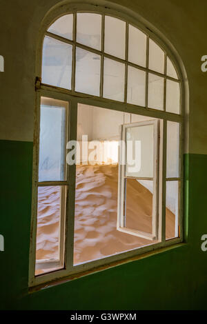 Kolmanskop (Afrikaans for Coleman's hill, German: Kolmannskuppe) is a ghost town in the Namib desert in southern Namibia. Stock Photo