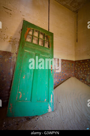 Kolmanskop (Afrikaans for Coleman's hill, German: Kolmannskuppe) is a ghost town in the Namib desert in southern Namibia,. Stock Photo