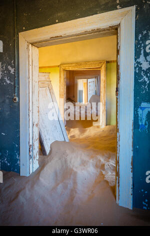 Kolmanskop (Afrikaans for Coleman's hill, German: Kolmannskuppe) is a ghost town in the Namib desert in southern Namibia,. Stock Photo