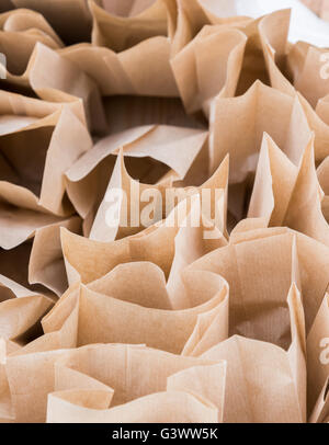 the Brown paper disposable bags in the pile Stock Photo