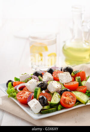 Fresh vegetable greek salad isolated on white Stock Photo