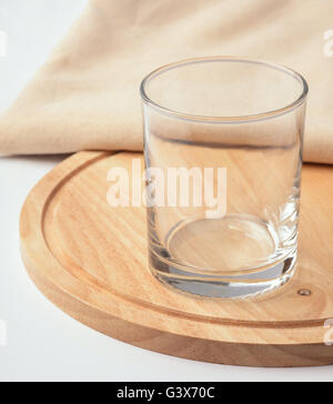 Empty glass on the cutting board Stock Photo