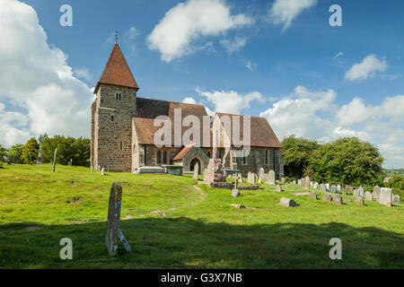 Spring afternoon at the Norman church of St Laurence in the village of Guestling near Hastings, East Sussex, England. Stock Photo