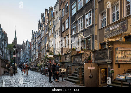 Tourist in Gdansk in Mariacka Street at sunset Stock Photo