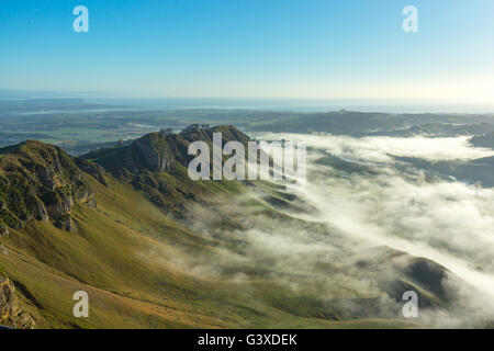 Geological forms with morning fog viewed from Te Mata Peak in Hawke's Bay, New Zealand. Stock Photo