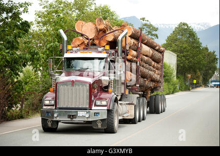 A logging truck on Logger's Lane in downtown Squamish.  Logging, Industry.  Canadian softwood lumber. Stock Photo