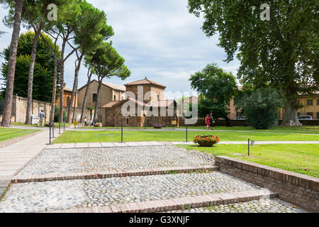 Ravenna,Italy-august 21,2015:view of exterior of Galla Placidia mausoleum from the San Vitale garden's during a cloudy day. Stock Photo