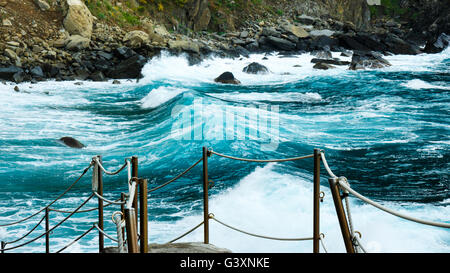 Seaside in Riomaggiore Italy with stormy bold blue sea Stock Photo