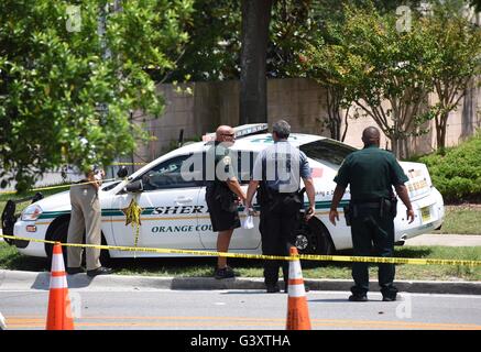 Orlando, USA. 15th June, 2016. Police officers work near the nightclub 'Pulse' where the mass shooting that killed at least 50 people including the gunman happened, in Orlando, Florida, the United States, June 15, 2016. Credit:  Yin Bogu/Xinhua/Alamy Live News Stock Photo