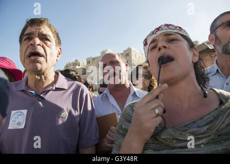 Jerusalem, Israel, Israel. 16th June, 2016. The Masorti Movement is a jewish-conservative religious group that believes in ploralism and deomcratic vision of Zionism. This morning the group tried to get together to a mutual prayer at the Western Wall as a step to demand a pluralist prayer space at the site. They we're protesting againts a haredi and religious youths and yeshiva students from the beginning to the end of the ceremony. Credit:  Danielle Shitrit/ZUMA Wire/Alamy Live News Stock Photo