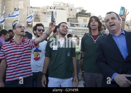 Jerusalem, Israel, Israel. 16th June, 2016. The Masorti Movement is a jewish-conservative religious group that believes in ploralism and deomcratic vision of Zionism. This morning the group tried to get together to a mutual prayer at the Western Wall as a step to demand a pluralist prayer space at the site. They we're protesting againts a haredi and religious youths and yeshiva students from the beginning to the end of the ceremony. Credit:  Danielle Shitrit/ZUMA Wire/Alamy Live News Stock Photo