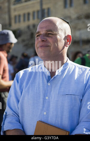 Jerusalem, Israel. 16th June, 2016. The Masorti Movement is a jewish-conservative religious group that believes in ploralism and deomcratic vision of Zionism. This morning the group tried to get together to a mutual prayer at the Western Wall as a step to demand a pluralist prayer space at the site. They we're protesting againts a haredi and religious youths and yeshiva students from the beginning to the end of the ceremony. Credit:  Danielle Shitrit/ZUMA Wire/Alamy Live News Stock Photo