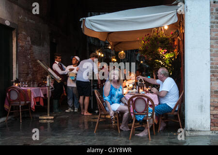 Venice, Italy. 15th June, 2016. People eat at the restaurant during the high water on June 15, 2016 in Venice, Italy. The high water in this period is exceptional, and it is a surprise for citizen and tourists.  Credit:  Simone Padovani /Awakening/Alamy Live News Stock Photo